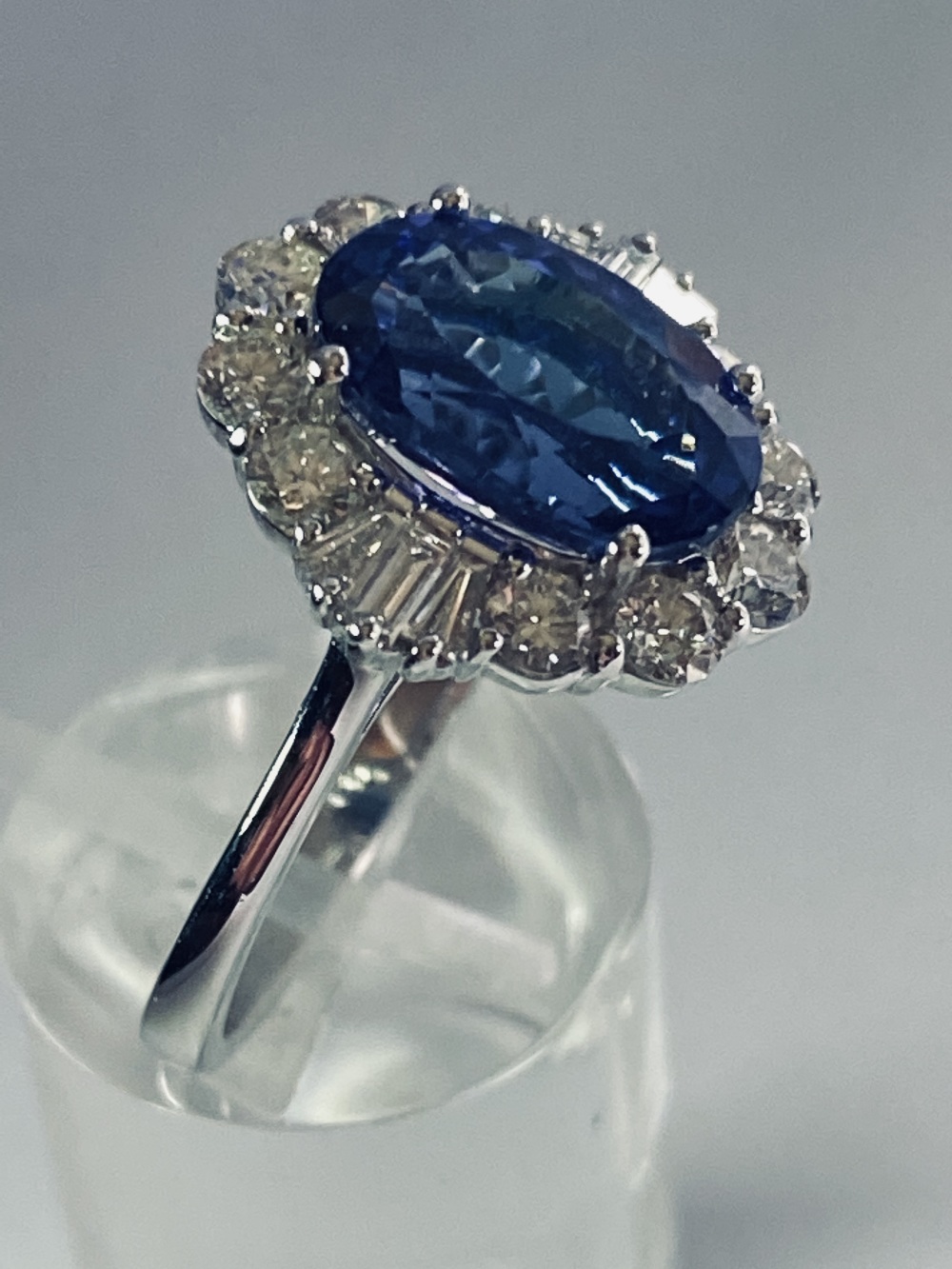 AN 18CT WHITE GOLD ART DECO STYLE TANZANITE AND DIAMOND CLUSTER RING, the superb oval shaped - Image 7 of 12