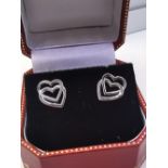 A PAIR OF 9CT WHITE GOLD DOUBLE HEART IRISH STUD EARRINGS, with push back closures. Fully