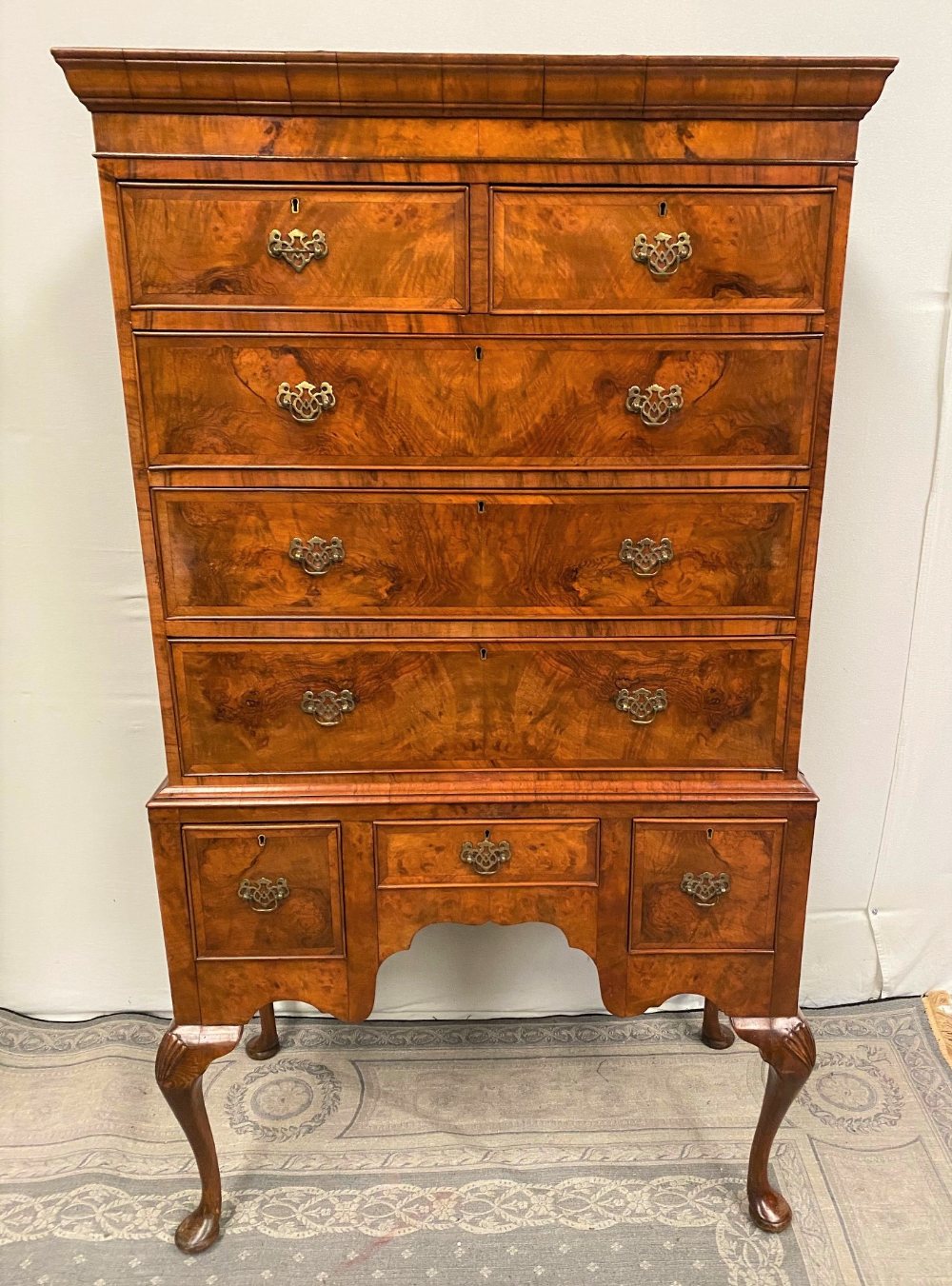 A VERY FINE QUEEN ANNE STYLE WALNUT CHEST ON STAND OR HIGH BOY, with cross-banded detail to the