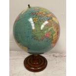 AN ORNAMENTAL GLOBE, on a mahogany spinning stand, in very good condition, 67cm tall x 48cm wide