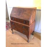 A WALNUT FALL FRONT BUREAU CHEST, with drop down top which opens to reveal compartments within, with