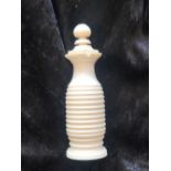 A CHINESE HAND CARVED IVORY SNUFF BOTTLE, approx. 4 inches high, with original spoon. Circa 1900-194