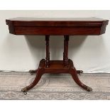 A GOOD QUALITY REGENCY FOLD OVER MAHOGANY CARD TABLE, with flame mahogany top having cross-banded ro