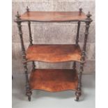 A NEATLY SIZED THREE TIER WHAT-NOT, with three serpentine shaped open shelves, each raised on turned