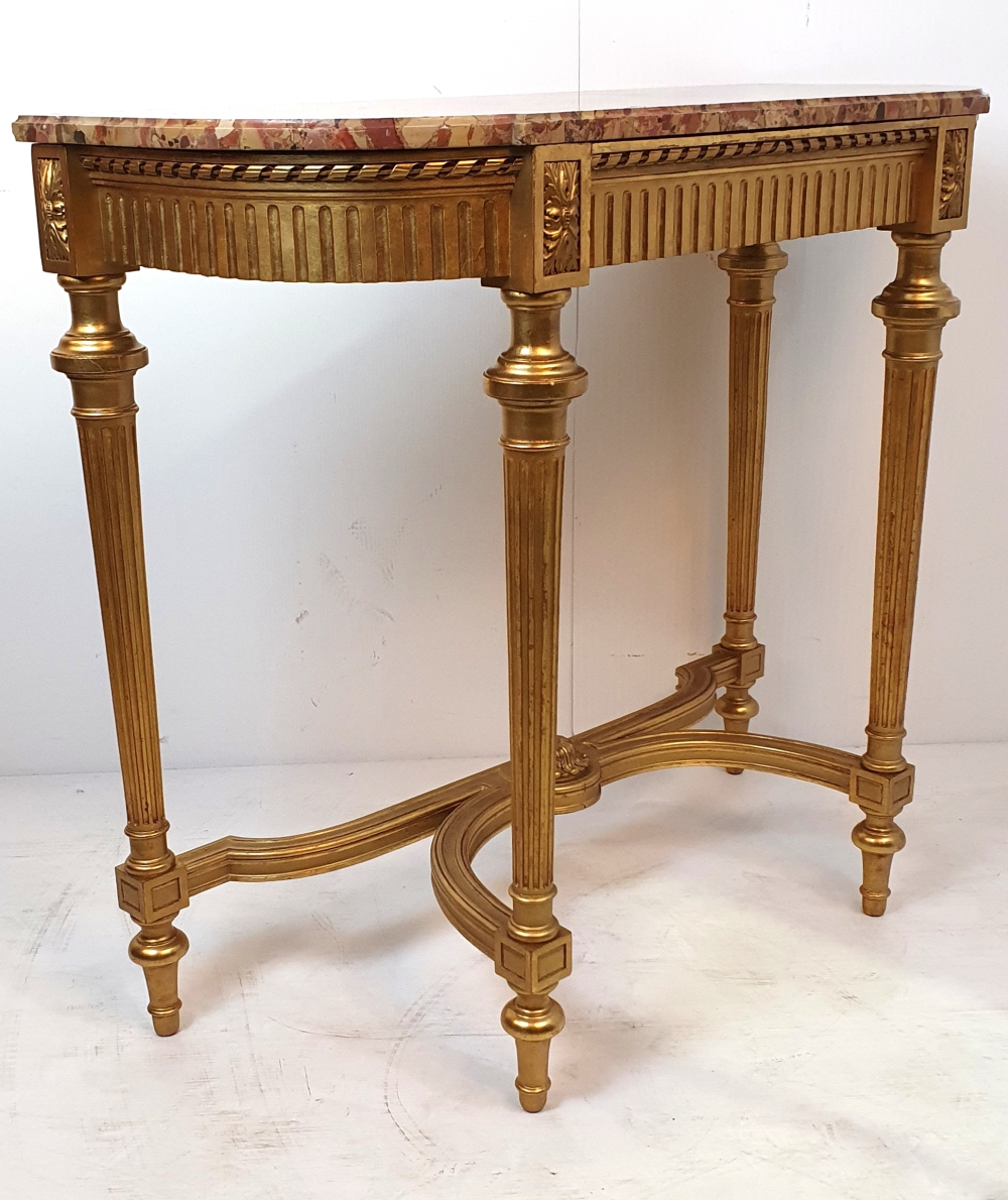 A VERY FINE 19TH CENTURY MARBLE TOP GILT CONSOLE TABLE, with breakfront, the frame decorated with a - Image 2 of 4