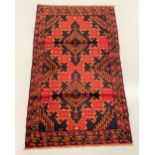 A BELOUCH TRIBAL CARPET, hand woven in the Shindan province of Eastern Afghanistan. Design: Geometri