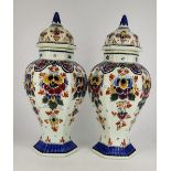 A PAIR OF DUTCH LIDDED VASES, decorated with floral motif