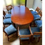 A GOOD QUALITY MAHOGANY DINING ROOM TABLE, extends, with an additional 3 leaves. Raised on carved le