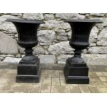 A PAIR OF BLACK GARDEN URNS, classical shape, size: 27 inches tall approx.