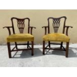 A FINE PAIR OF IRISH MAHOGANY ARM CHAIRS, with shaped crest rail over a pierced splat back, each wit
