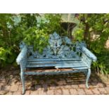 A VERY FINE HEAVY CAST IRON GARDEN SEAT on cabriole leg with leaf decoration to back, 58in wide x 3f