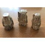 A SET OF THREE HAND CARVED GONE CHINESE IMMPORTALS, each stamped to the base. Approximately 2.5 to 3