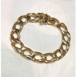 A 9CT YELLOW GOLD LARGE CHUNKY LINK BRACELET, with secure closure with two safety catches for extra