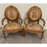 A PAIR OF GILT LOUIS XVI STYLE ARMCHAIRS with oval shaped back rests having ribbon detail to the edg