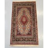 A PERSIAN MOUD CARPET, hand woven in the city of Moud, Khorasan Province, Iran. Material: hand woven