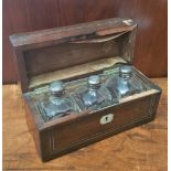 A SET OF THREE CASED SCENT BOTTLES, each with a silver screw on top and glass stopper, (2 in very go