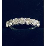 AN 18CT WHITE GOLD SEVEN STONE DIAMOND RING, 2.20cts of diamonds all claw set, and of excellent qual