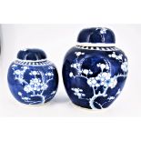 TWO 20TH CENTURY BLUE & WHITE GINGER JARS, with lids