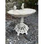 A BIRD BATH GARDEN ORNAMENT, with two little birds sitting upon the open shell bath, size: 2 ft tall