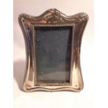 AN EARLY 20TH CENTURY SILVER PHOTO/PICTURE FRAME, Birmingham, 1919, with beaded edging and foliage d