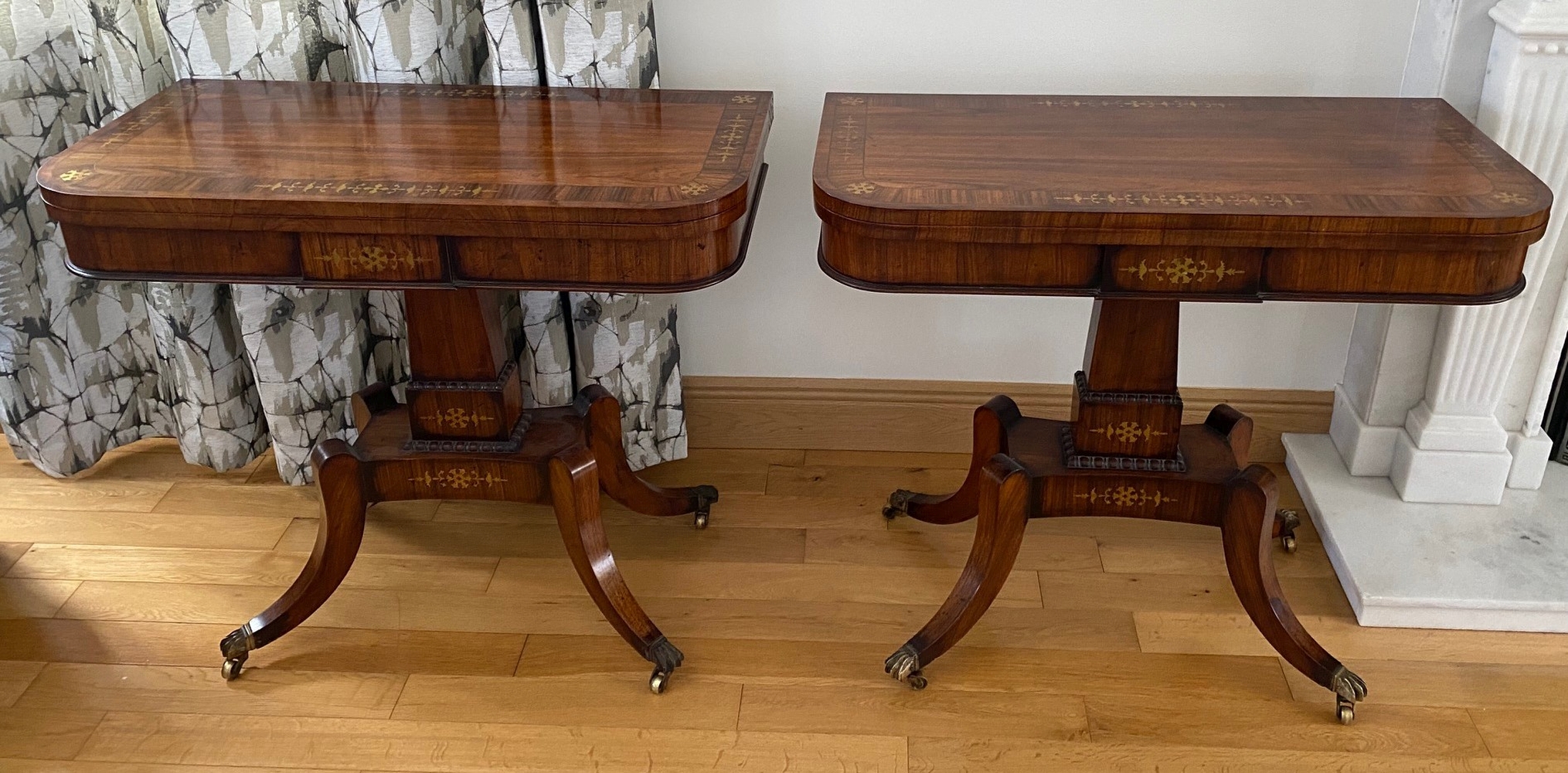 A VERY FINE PAIR OF FOLD OVER ROSEWOOD CARD TABLES, each with brass inlaid decoration, the tops open
