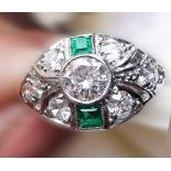 AN INCREDIBLE ART DECO STYLE PLATINUM EMERALD AND DIAMOND RING, Gemstones: Emerald: 0.40ct, Diamonds