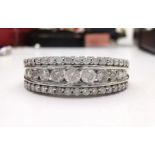 A STUNNING TRIPLE ROW DIAMOND RING, total weight of ring 4 grams’ approx. face of ring 7mm long, ban