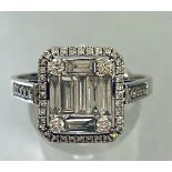 AN 18CT WHITE GOLD BAGUETTE AND ROUND BRILLIANT CUT DIAMOND RING, total diamond weight is 2.20cts ap