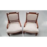 A PAIR OF GOOD QUALITY WALNUT LOW RISE CHAIRS / BEDROOM CHAIRS, with down swept scroll shaped elbow