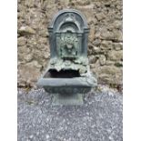 A GARDEN WATER WALL FONTAIN, with blossoms and fruit decorations, size: 43 inches tall approx.