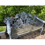 A VERY FINE HEAVY CAST IRON GARDEN SEAT ON CABRIOLE LEG WITH LEAF DECORATION TO BACK, wooden slats n