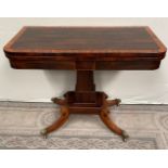 A FINE REGENCY ROSEWOOD FOLD OVER CARD TABLE, with cross-banded top having rounded corners, over a d