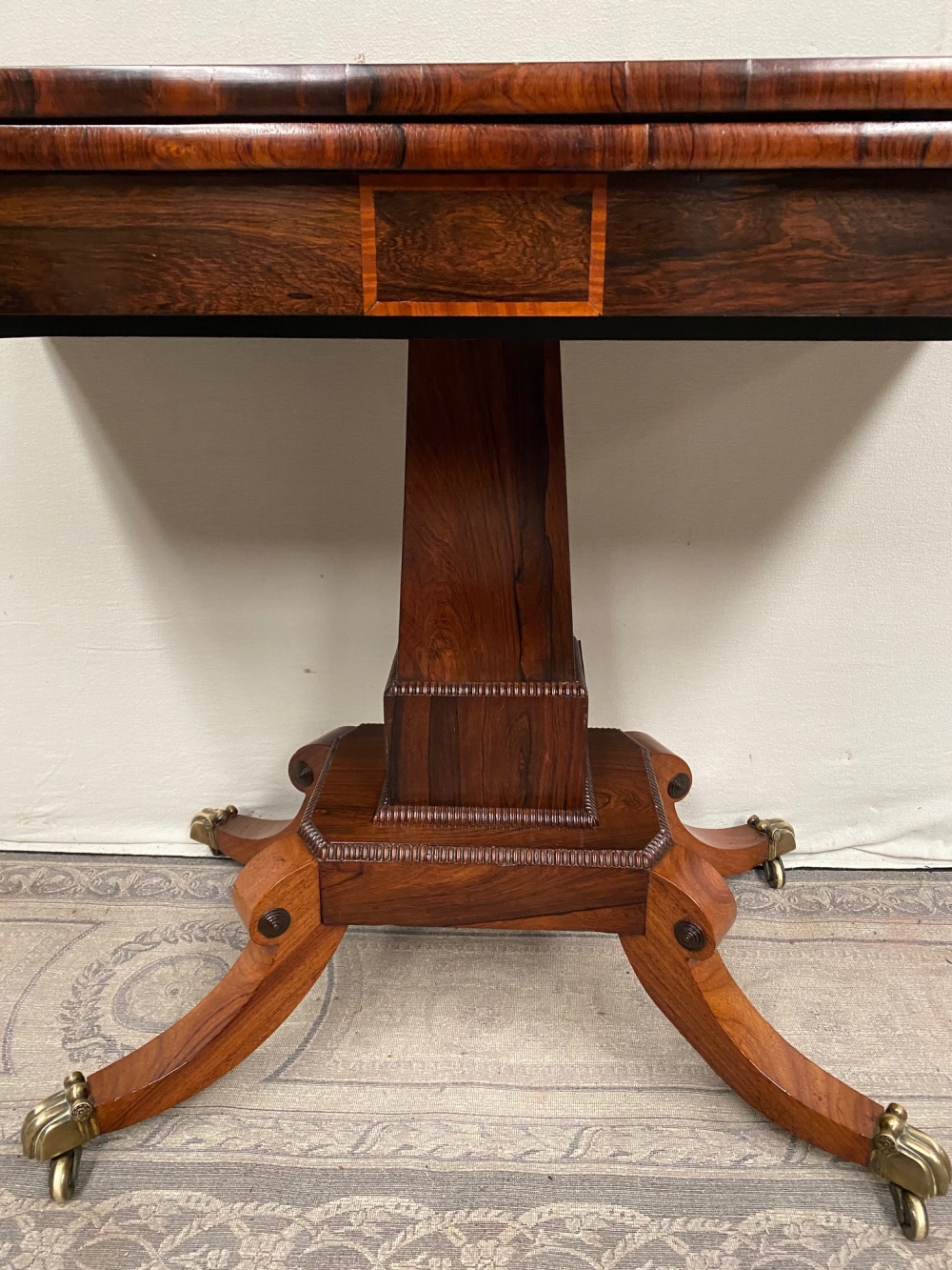 A FINE REGENCY ROSEWOOD FOLD OVER CARD TABLE, with cross-banded top having rounded corners, over a d - Image 2 of 7