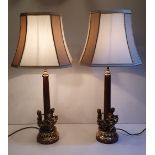 A GOOD QUALITY PAIR OF EARLY 20TH CENTURY MARBLE AND BRASS TABLE LAMPS, each with three dancing cher