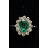 A BEAUTIFUL 18CT WHITE GOLD COLUMBIAN EMERALD AND DIAMOND CLUSTER RING, a wonderful handmade ring of