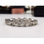 A BEAUTIFUL 14CT WHITE GOLD PRINCESS CUT DIAMOND TRILOGY RING, with beautiful square princess cut ge