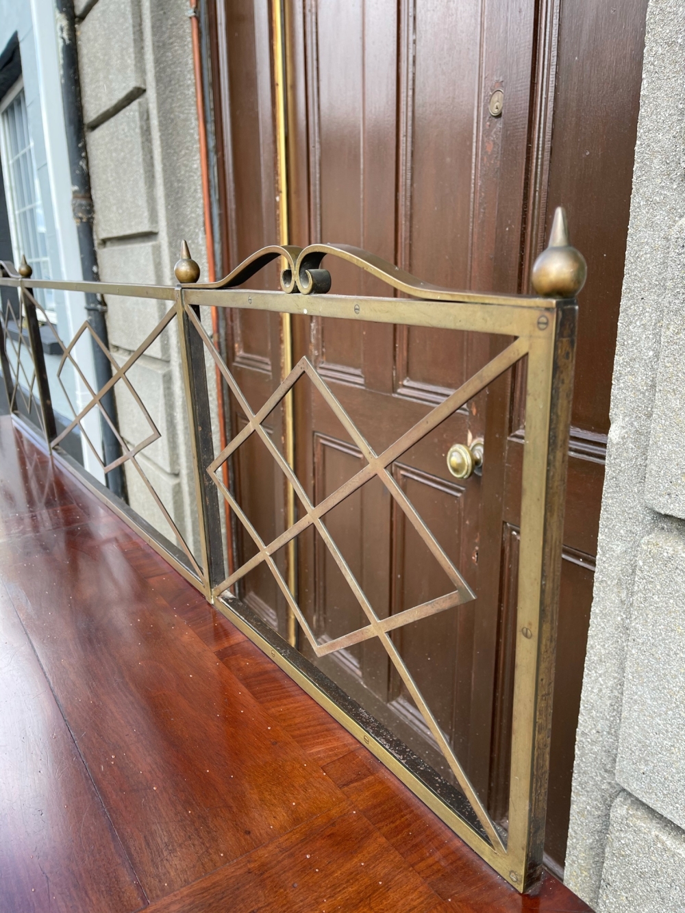 A GOOD QUALITY IRISH MAHOGANY SERVING / SIDE BOARD, with brass gallery rail to the back, with cross- - Image 6 of 7