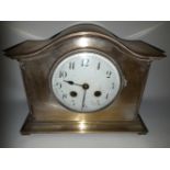 A SILVER PLATED MANTLE CLOCK, with engraved presentation inscription dated 1926, 235mm long x 19cm h