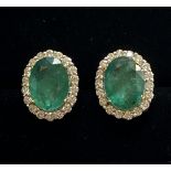 A PAIR OF 18CT WHITE GOLD STUNNING COLOMBIAN EMERALD AND DIAMOND CLUSTER EARRINGS, Emeralds: 6.70cts