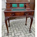 A CHIPPENDALE STYLE ESCRITOIRE DESK, with raised back gallery having an arrangement of drawers and c