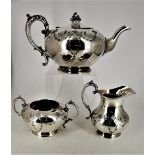 A JAMES DIXON PLATED TEA SET, made in Sheffield, England, includes tea pot, sugar bowl and jug.