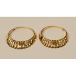 A PAIR OF 9CT GOLD RINGS, each with a fan design to the top, marked .375, ring size: M, weight of bo