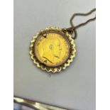 A FULL GOLD SOVEREIGN COIN NECKLACE, 1910 sovereign coin, made of pure 22ct gold, mount and chain cr