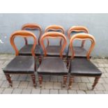 A SET OF 6 VICTORIAN BALLOON BACK DINING ROOM CHAIRS, each with carved inside edge to the balloon ba