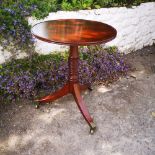 A GOOD QUALITY CIRCULAR OCCASSIONAL / SIDE TABLE, with double lip rim, raised on turned column suppo