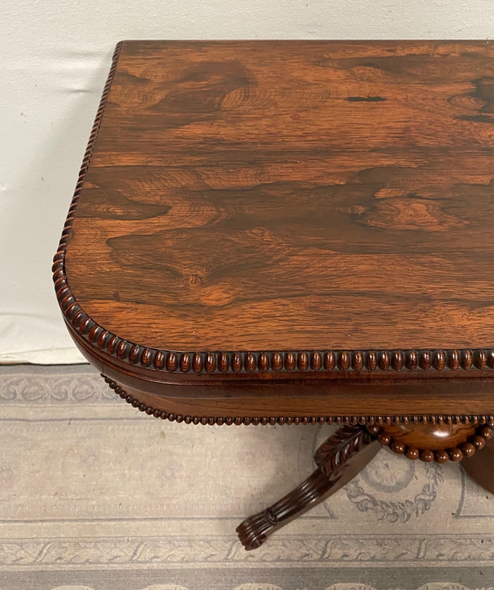 A VERY FINE REGENCY ROSEWOOD FOLD OVER CARD TABLE, with gadrooned rim to the curved fold over top, a - Image 4 of 6