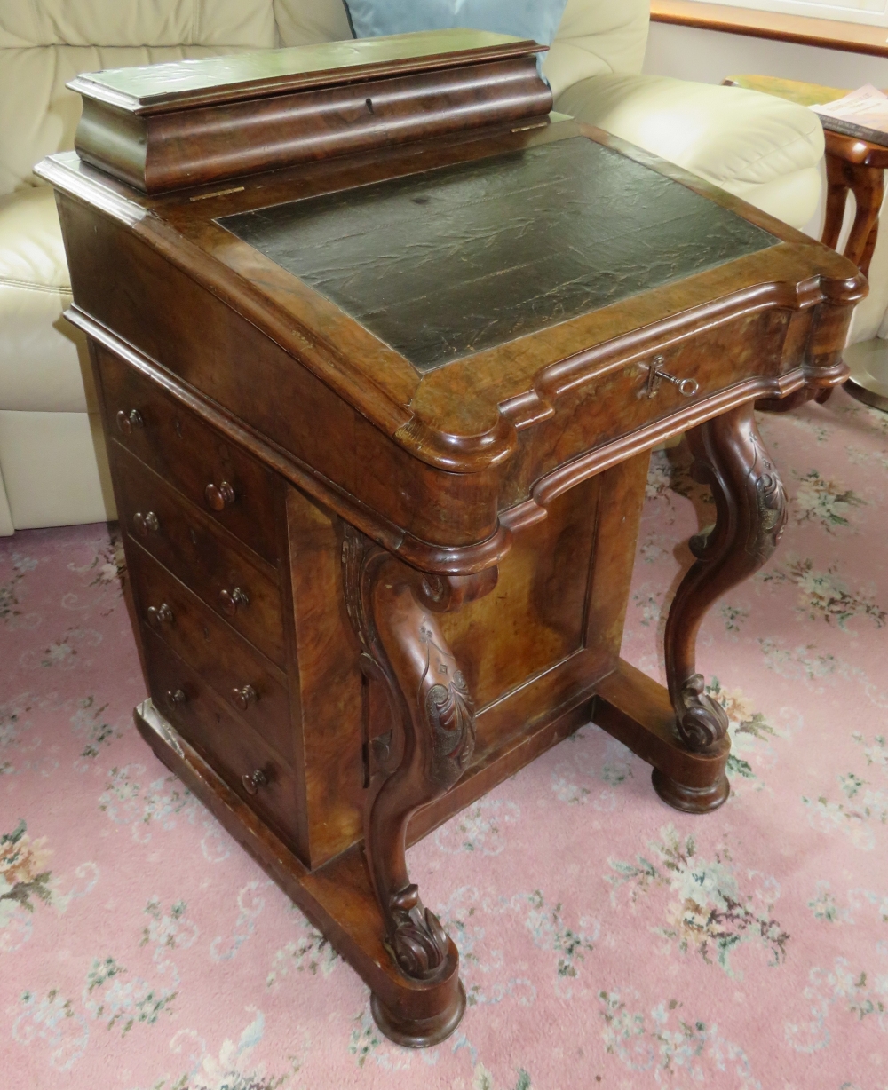 A GOOD VICTORIAN WALNUT DAVENPORT DESK, circa 1880s, the leather covered writing slope lifts up to r