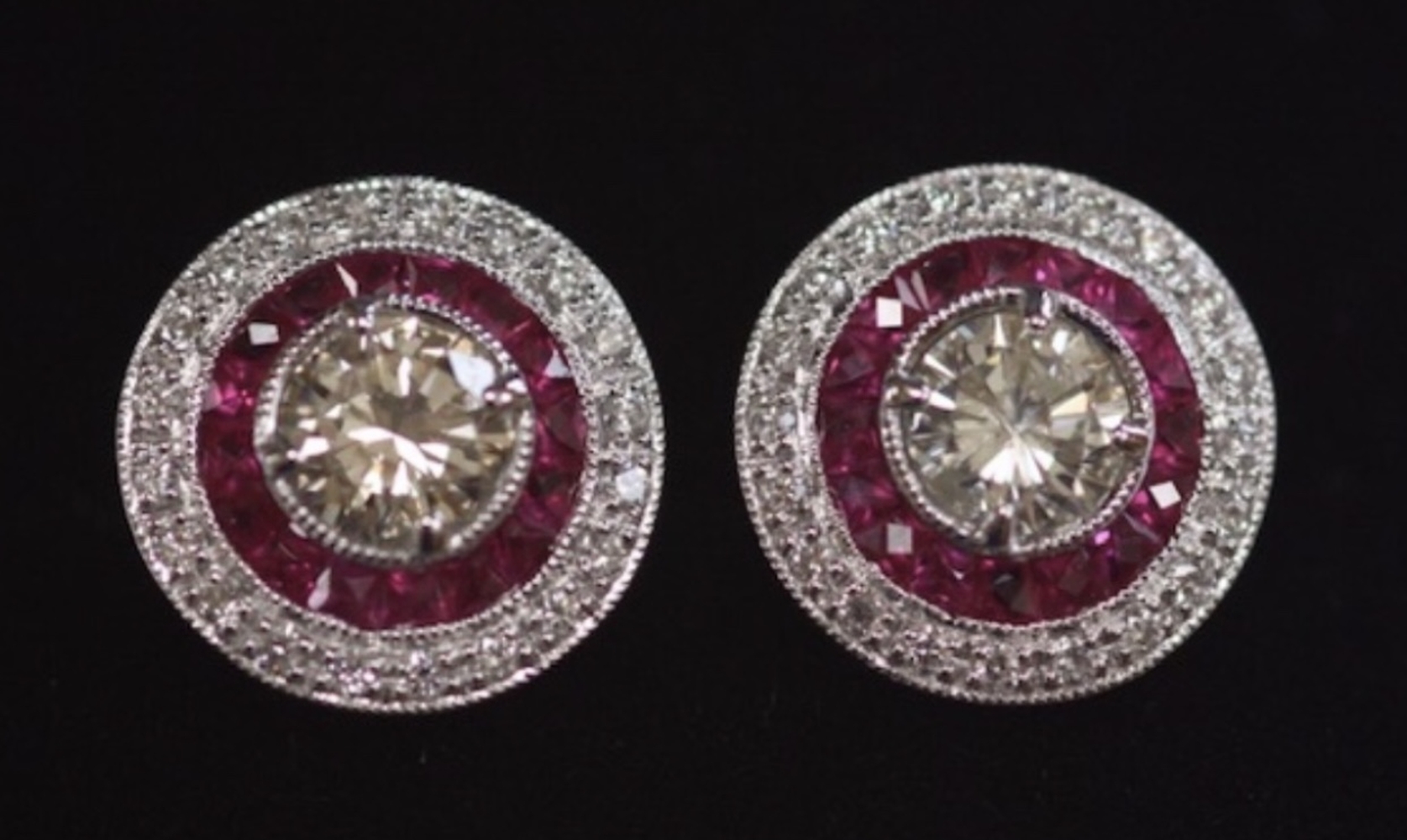 A PAIR OF 18CT WHITE GOLD TARGET STYLE RUBY & DIAMOND EARRINGS, with 2.40cts approx.