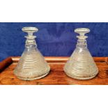 A PAIR OF LATE 19TH / EARLY 20TH CENTURY CUT GLASS SHIPS DECANTERS, each with a star cut mushroom st