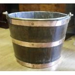 A 19TH CENTURY OAK COPPER BOUND BUCKET, with brass carrying handle, 26 x 33cm approx. (H x W).